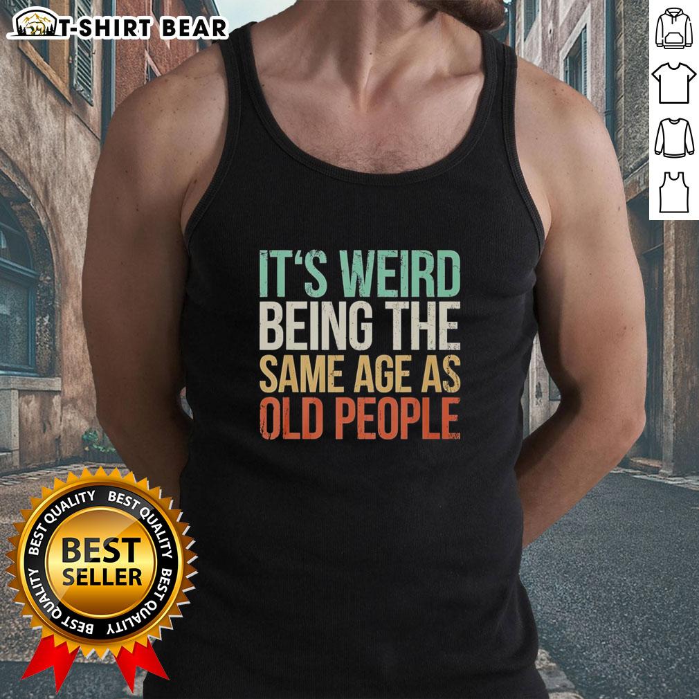 Vintage tank top featuring 'It's Weird Being The Same Age As Old People' design, perfect for nostalgic fashion lovers.