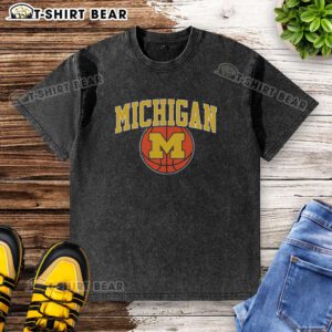 Vintage washed t-shirt featuring Michigan basketball logo, perfect for fans and collectors of Michigan sports apparel.