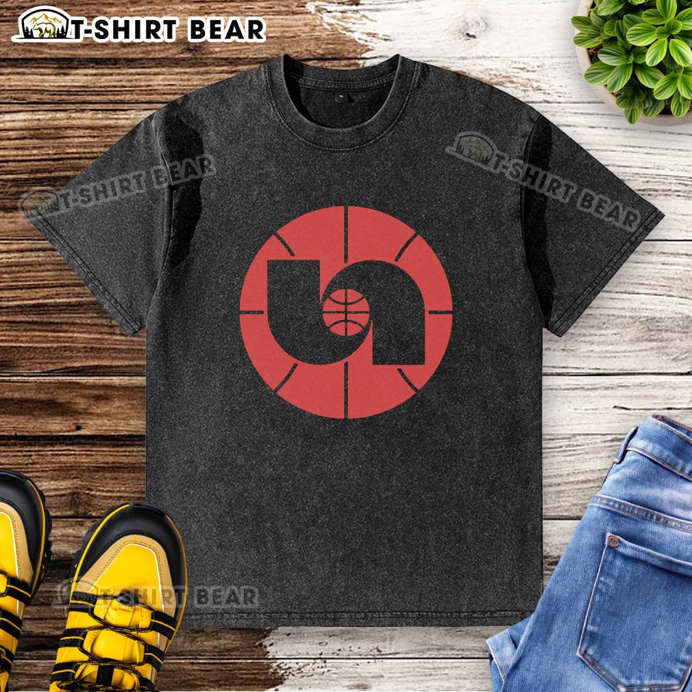 Alt Text: Vintage 1980s Nebraska Basketball logo on a washed t-shirt, perfect for fans and collectors of retro sports apparel.