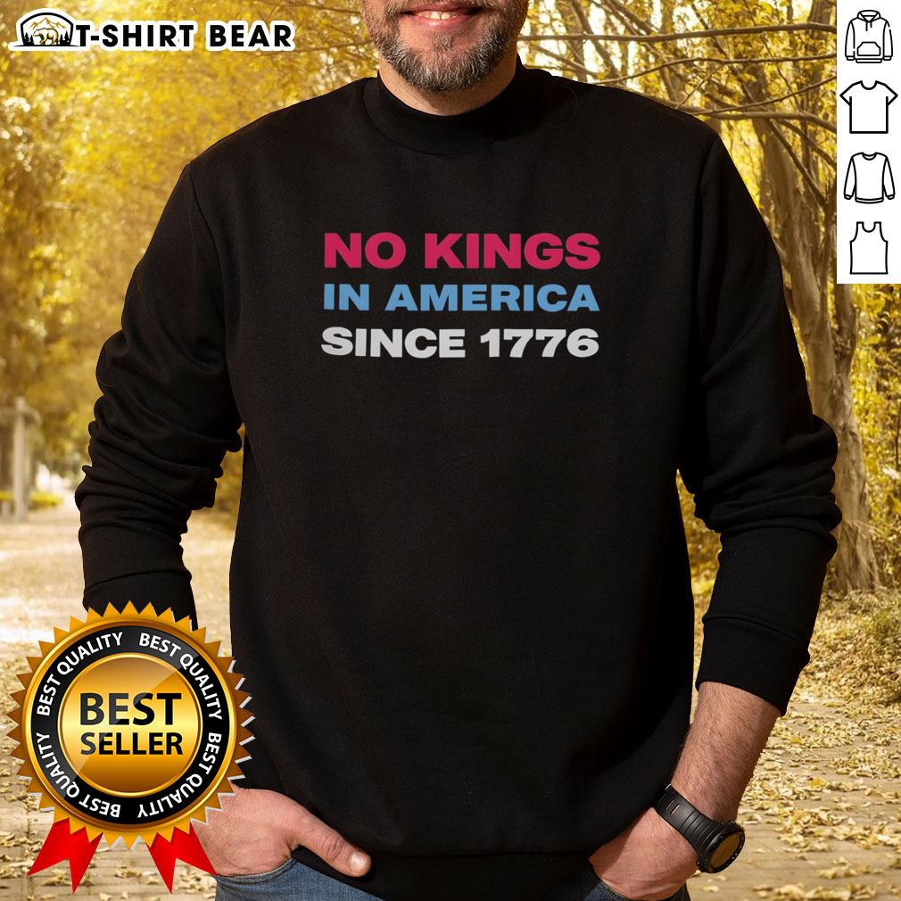 Jamie Lee Curtis wearing a retro sweatshirt featuring 'No Kings in America Since 1776' design, celebrating freedom.