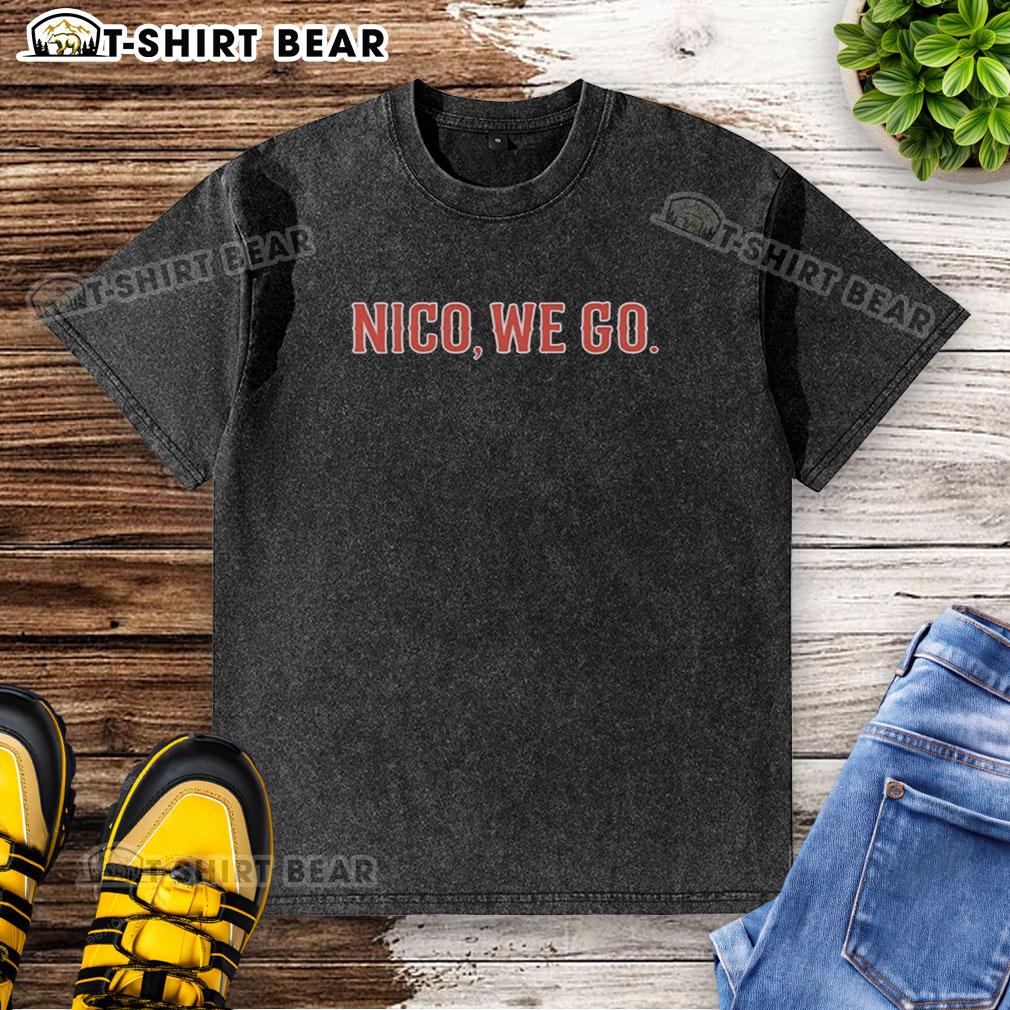 Alt Text: Nico Hoerner wearing a Chicago Cubs baseball washed t-shirt, showcasing team spirit and style on game day.