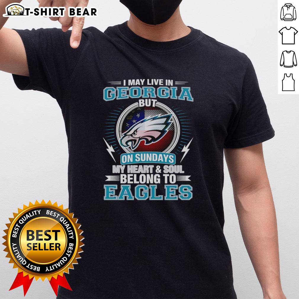 Official Philadelphia Eagles t-shirt featuring 'I May Live In Georgia But My Heart Belongs To Eagles' slogan.