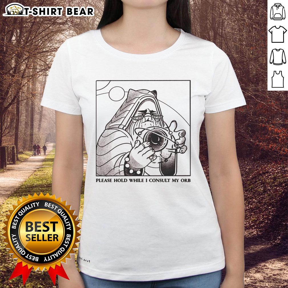 Official Please Hold While I Consult My Orb Ladies Tee featuring a whimsical design and vibrant colors for casual wear.