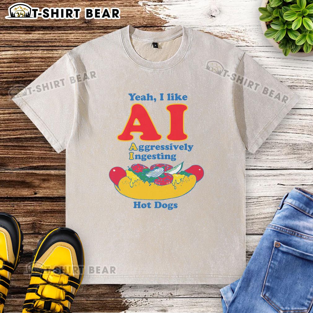 Alt Text: Original design of a t-shirt featuring AI humor with a graphic of a robot aggressively ingesting hot dogs.