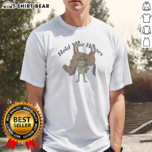 Premium Hold Your Horses Frog Cowboy Humor Funny Animal Shirt featuring a green frog in cowboy attire on a comfortable cotton tee