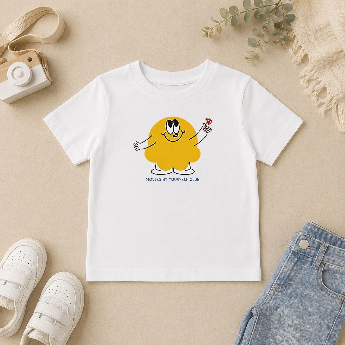 Pretty Movies By Yourself Club Yellow Blob Character Holding A Red Candy Art Kids T Shirt Pretty Movies By Yourself Club Yellow Blob Character Holding A Red Candy Art Kids T-Shirt