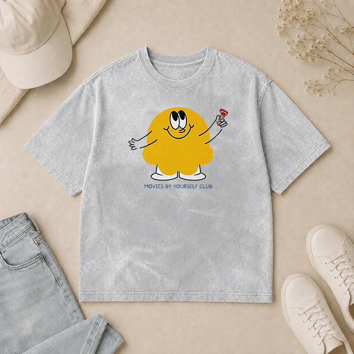 Pretty Movies By Yourself Club Yellow Blob Character Holding A Red Candy Art Washed T Shirt Pretty Movies By Yourself Club Yellow Blob Character Holding A Red Candy Art on a soft washed t shirt in yellow