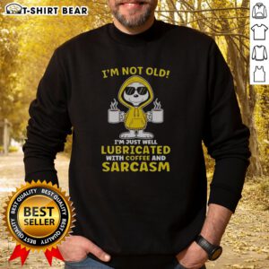 Top Snoopy Peanuts I'M Not Old I Am Just Well Lubricated With Coffee And Sarcasm Sweatshirt in a cozy setting