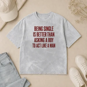 Funny Being Single Is Better Than Asking A Boy To Act Like A Man Quote printed on a soft washed t shirt in light grey
