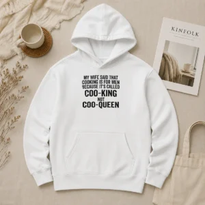Nice Good My Wife Said That Cooking Is For Men Because It Is Called Coo King Not Coo Queen Hoodie in black, front view with printed text design