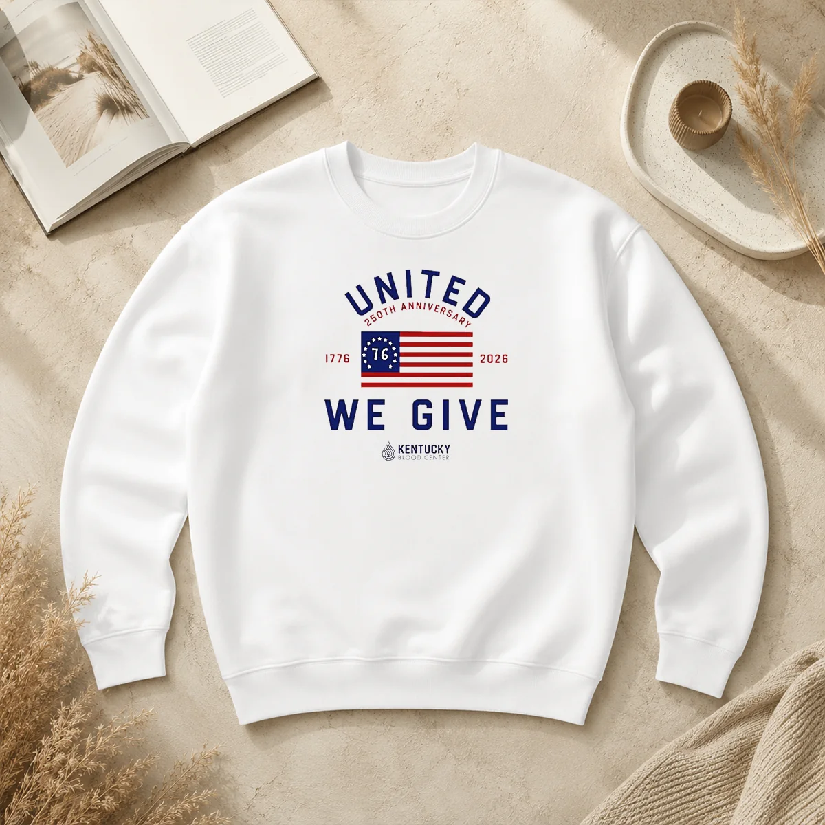 Original United 250th Anniversary 1776 2026 We Give Kentucky Blood Center Sweater Original United 250th Anniversary 1776 2026 We Give Kentucky Blood Center sweater in dark color with bold anniversary design