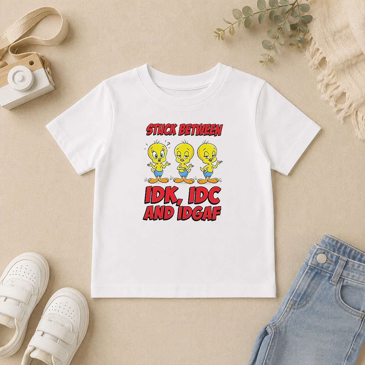 Pretty Tweety Stuck Between IDK IDC And IDGAF Kids T Shirt Pretty Tweety Stuck Between IDK IDC And IDGAF Kids T Shirt featuring colorful graphic on soft cotton fabric